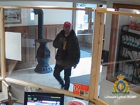Pictured is the suspect entering the business.