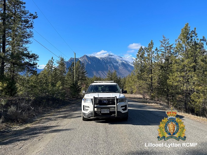 Pictured is an RCMP vehicle with a clear blue sky above.