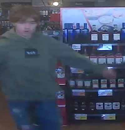 Male youth suspect with brown hair wearing a green hoodie