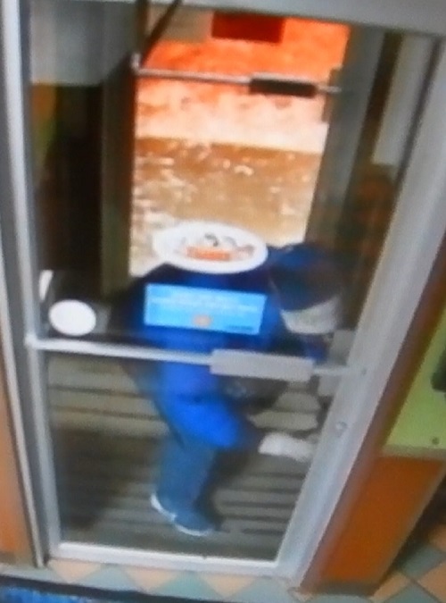 Suspect wearing a blue winter coat, blue jeans and blue runners