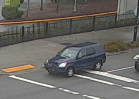 Surveillance photo of dark grey Honda CR-V suspect vehicle